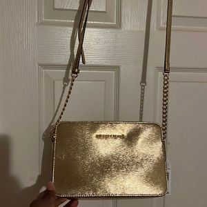 Brand new gold square mk purse.